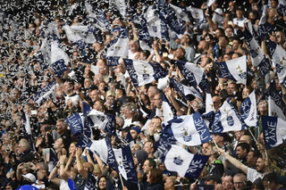 Tottenham fans wave flags during the ceremony after the game