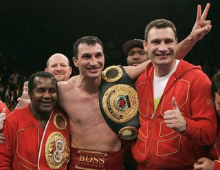 File photo of Klitschko of Ukraine celebrating win in heavyweight championship with trainer Emanuel Steward in New York