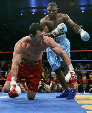 Heavyweight Samuel Peter sends Wladimir Klitschko to the mat during fifth round of NABF Championship bout in Atlantic City, New Jersey