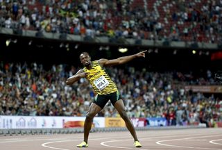 Bolt of Jamaica reacts after winning the men's 100m final during the 15th IAAF World Championships at the National Stadium in Beijing