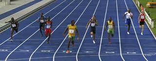 Bolt of Jamaica crosses the finish line ahead of the competition in the men's 200 meters final during the world athletics championships in Berlin
