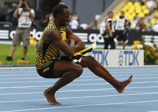 Bolt of Jamaica performs a dance as he celebrates winning the men's 4x100 metres relay final during the IAAF World Athletics Championships at the Luzhniki stadium in Moscow