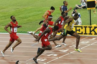 Usain Bolt of Jamaica (R) crosses the finish line ahead of Tyson Gay of the U.S., Su Bingtian of China, Mike Rodgers of the U.S., Justin Gatlin of the U.S., Trayvon Bromell of the U.S. and Jimmy Vicaut of France (L-R) compete in the men's 100 metres final