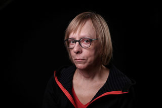 Pam Akerstrom, 63, poses for a #MeToo portrait in Detroit