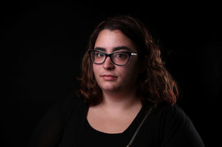 April Slusser, 24, poses for a #MeToo portrait in Detroit