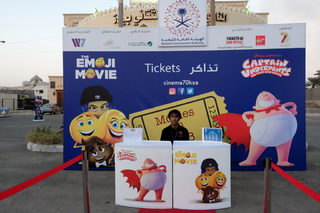 A man sells tickets at the first Saudi cinema at cultural club in Jeddah