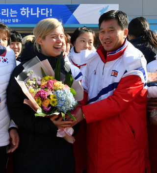 Sarah Murray, head coach of the combined women's ice hockey team is seen as North Korean women's ice hockey players arrive at the South Korea's national training center