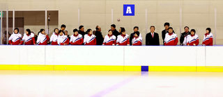 North Korea' women's ice hockey team members look around South Korea's ice link for their practice in Jincheon