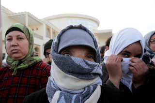 People attend a protest about the lack of jobs after two miners died while working in a clandestine coal mine, in Jerada