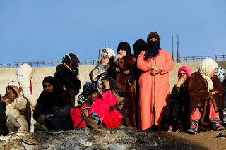 People attend a protest about the lack of jobs after two miners died while working in a clandestine coal mine, in Jerada