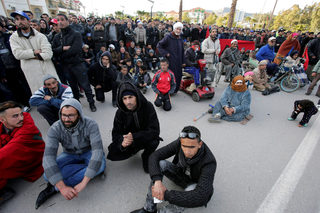 People attend a protest about the lack of jobs after two miners died while working in a clandestine coal mine, in Jerada