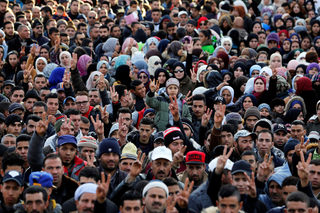 People attend a protest about the lack of jobs after two miners died while working in a clandestine coal mine, in Jerada