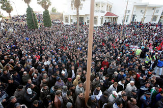 People attend a protest about the lack of jobs after two miners died while working in a clandestine coal mine, in Jerada