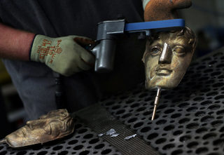 2018-02-07T142622Z_57619545_RC18B9163F20_RTRMADP_3_AWARDS-BAFTA-MASKS.JPG