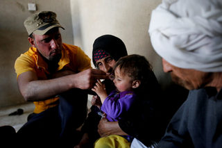 2018-03-28T130844Z_1079909066_RC18E48B68E0_RTRMADP_3_IRAQ-MOSUL-DISPLACED-RETURN.JPG