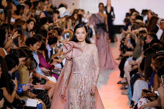 A model presents a creation by designer Elie Saab as part of his Haute Couture Fall/Winter 2018/2019 fashion show in Paris