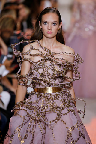 A model presents a creation by designer Elie Saab as part of his Haute Couture Fall/Winter 2018/2019 fashion show in Paris