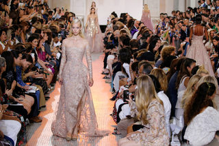 A model presents a creation by designer Elie Saab as part of his Haute Couture Fall/Winter 2018/2019 fashion show in Paris