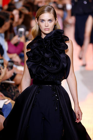 A model presents a creation by designer Elie Saab as part of his Haute Couture Fall/Winter 2018/2019 fashion show in Paris