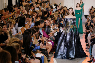 A model presents a creation by designer Elie Saab as part of his Haute Couture Fall/Winter 2018/2019 fashion show in Paris