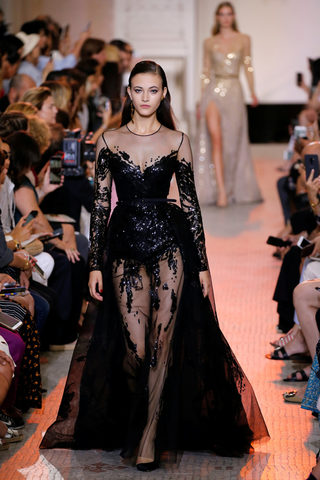 A model presents a creation by designer Elie Saab as part of his Haute Couture Fall/Winter 2018/2019 fashion show in Paris