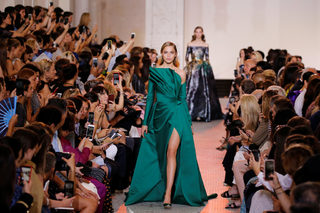 A model presents a creation by designer Elie Saab as part of his Haute Couture Fall/Winter 2018/2019 fashion show in Paris