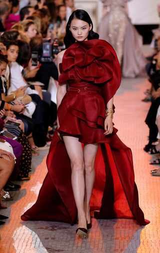 A model presents a creation by designer Elie Saab as part of his Haute Couture Fall/Winter 2018/2019 fashion show in Paris