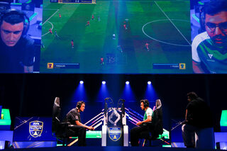 Kurt 'Kurto411' Fenech (L) of Malta competes against Mosaad 'MSDossary' Aldossary of Saudia Arabia in the Semi Final of the FIFA eWorld Cup 2018 at The O2 Arena in London