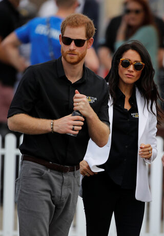 Britain's Prince Harry and Meghan, Duchess of Sussex, attend the Invictus Games Sydney 2018 Jaguar Land Rover Driving Challenge on Cockatoo Island, Sydney