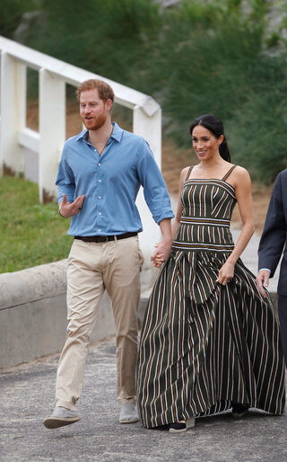 Britain's Harry and his wife Meghan, Duchess of Sussex, visit Bondi Beach in Sydney