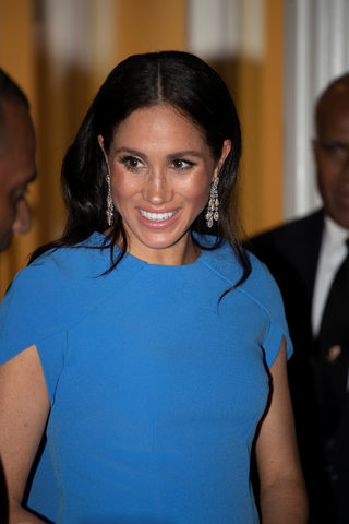 Britain's Meghan, the Duchess of Sussex, attends a state dinner at Grand Pacific Hotel in Suva, Fiji