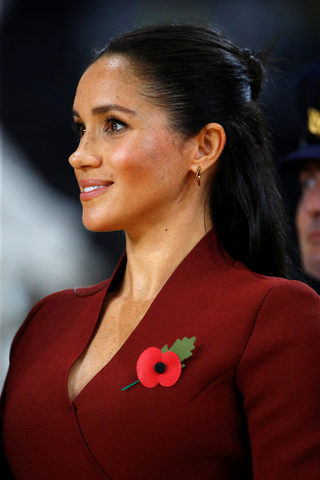 Meghan, Duchess of Sussex, looks on before handing out awards to the Invictus Games Sydney 2018 wheelchair basketball medallists at Quaycentre in Sydney, Australia