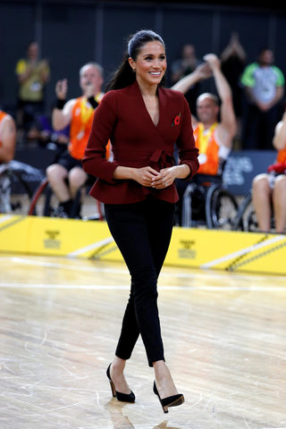 Meghan, Duchess of Sussex, walks after the Invictus Games Sydney 2018 wheelchair basketball finals at Quaycentre in Sydney, Australia