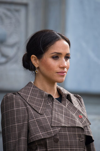 Meghan, Duchess of Sussex observes a minutes silence during a visit to view the newly unveiled UK war memorial and Pukeahu National War Memorial Park, in Wellington