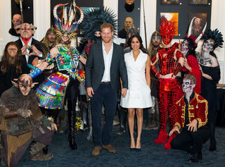 Britain's Prince Harry and Meghan, Duchess of Sussex, meet actors in costumes during a visit to Courtenay Creative, in Wellington