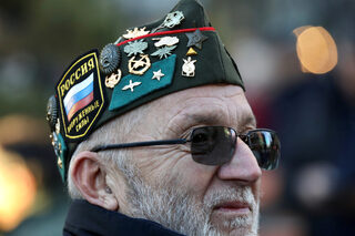 A man with badges on his hat during the visit of Russian President Vladimir Putin in Belgrade