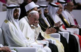 Pope Francis sits next to Abu Dhabi's Crown Prince Mohammed bin Zayed Al-Nahyan during an inter-religious meeting at the Founder's Memorial in Abu Dhabi