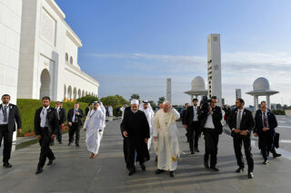 Pope Francis arrives for a meeting with the Muslim Council of Elders at the Sheikh Zayed Grand Mosque in Abu Dhabi