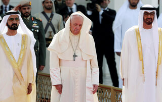 Pope Francis is welcomed by Vice-President of the United Arab Emirates and ruler of Dubai Sheikh Mohammed bin Rashid al-Maktoum, and Abu Dhabi's Crown Prince Mohammed bin Zayed Al-Nahyan during a welcome ceremony at the Presidential Palace in Abu Dhabi