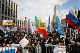 People attend a rally to protest against tightening state control over internet in Moscow