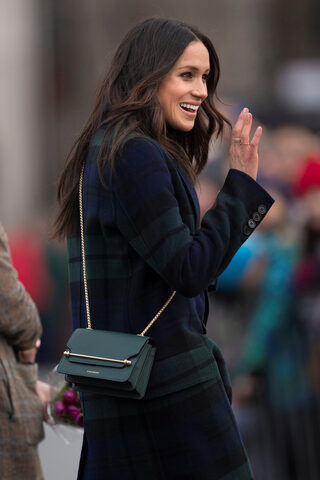 FILE PHOTO: Meghan Markle, the fiancee of Britain's Prince Harry, arrives for a walkabout on the esplanade at Edinburgh Castle