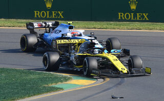 Renault's Daniel Ricciardo overtakes through turn one during the Formula One F1 Australian Grand Prix at the Albert Park Grand Prix Circuit in Melbourne