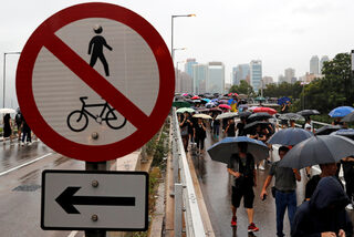 People march during a rally to demand democracy and political reforms in Hong Kong