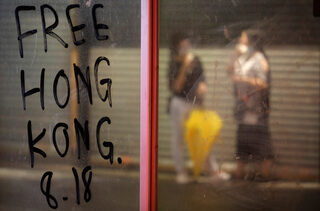 People march during a rally to demand democracy and political reforms in Hong Kong