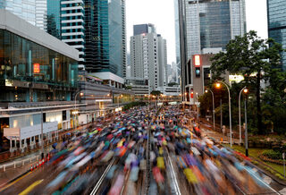 People march during a rally to demand democracy and political reforms in Hong Kong