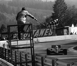 Senna his JPS Renault crosses the finish line to win the Belgian GP September 15 1985 Senna took the lead from the start of the race.jpg