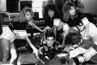 Senna concentrates before time trials April 11, 1986 for Sunday\'s Spanish Grand Prix as John Player publicity girls surround his Lotus-Renault. Senna finished first in the trials.jpg