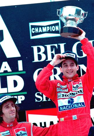 Senna of Brazil holds up his champion\'s trophy after winning the 1988 Belgian Grand Prix in Francorchamps August 28, 1988, giving him the lead in the Formula One competition in his McLaren.jpg