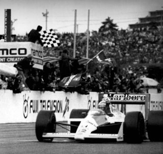 Senna in a McLaren-Honda takes the checkered flag to win Sunday\'s Japan Formula One Grand Prix at the Suzuka Circuit course in central Japan, October 30, 1988.jpg