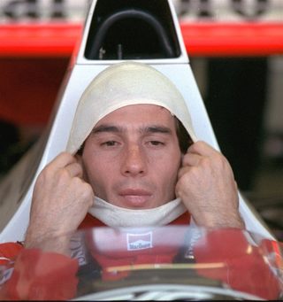 Senna, in a McLaren Honda, pulls on a fire resistant mask before going out to practice for the Australian Grand Prix November 4, 1989.jpg